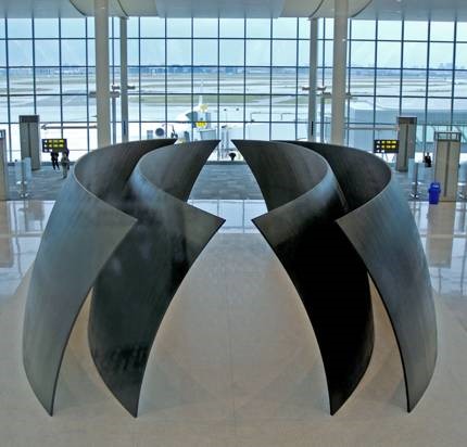 Richard Serra, Tilted Spheres, 2002–04, Cor-ten steel, 14’ x 39’ x 22’. Pearson International Airport, Toronto, Canada.